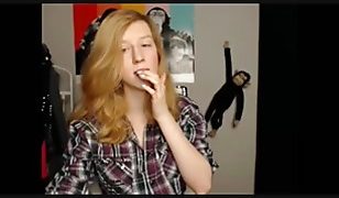 18 year old teen takes off her red bra and shows off her delicious big tits.